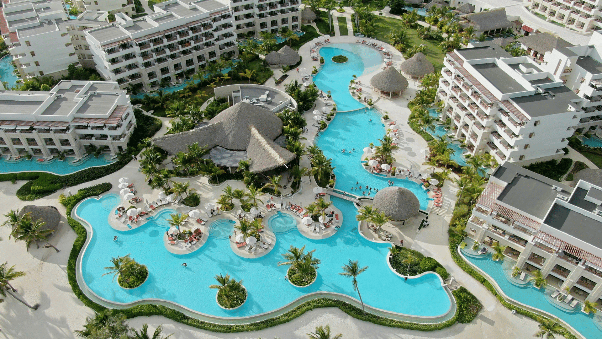Aerial view of a Maldives island resort and overwater villas